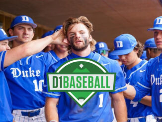 Duke baseball players in blue uniforms in the dugout.